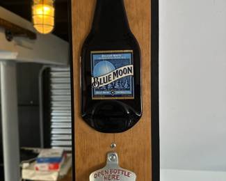 Blue Moon wood panel bottle opening 