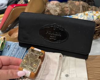 Louis Vuitton cuff and Prada wallet