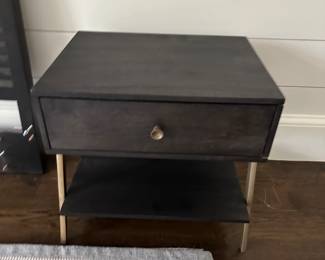 Pair of ebony nightstands with brushed gold hardware 