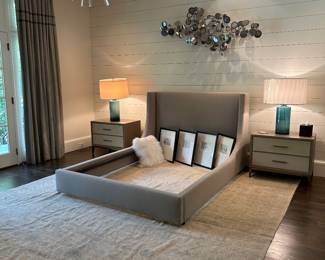 Room and Board neutral pale grey boucle bed and Arhaus Malone nightstands on an oushak rug 