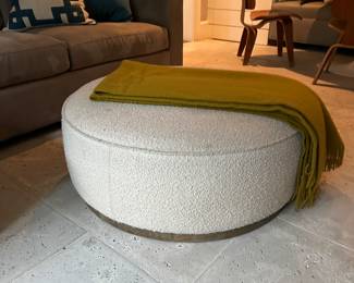 Four hands Sinclair ottoman in a neutral boucle