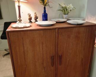 Mid Century Modern short men's wardrobe cabinet.