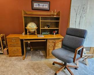 Oak desk and comfortable office chair. The Globe lights up.