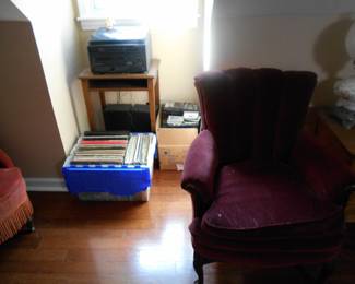 record player and albums, upholstered chair0.