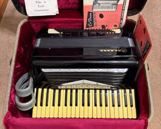 Vintage 1950's Lo Duca Bros Belsono 3 1/2 Octave accordion with case and original warrantee/ registration card.