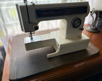 Kenmore Ultra stitch 12 sewing machine/model 15611 AND sewing machine cabinet