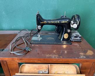 Vintage Singer Sewing Machine in sewing cabinet