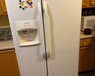 Frigidaire side-by-side refrigerator/freezer with ice-maker and water dispenser