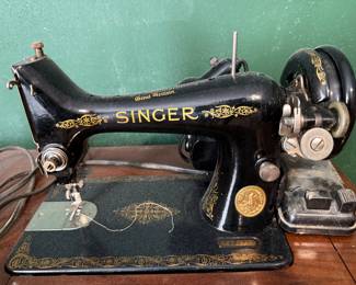 Vintage Singer Sewing Machine in sewing cabinet