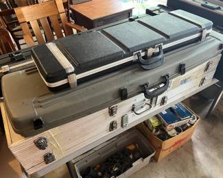 Numerous gun cases/guards.
