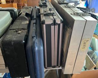 Numerous gun cases/guards.