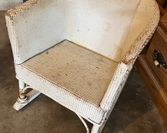 Vintage child’s wicker rocking chair.