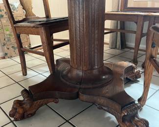 Base of oak clawfoot dining table.