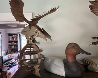 Hand-carved canvasback duck decoy, signed “GD /1985”; 3D eagle sculpture.