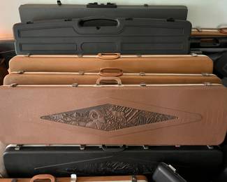 Numerous gun guards/cases, many vintage, by Doskocil, Browning, Plano, and others.