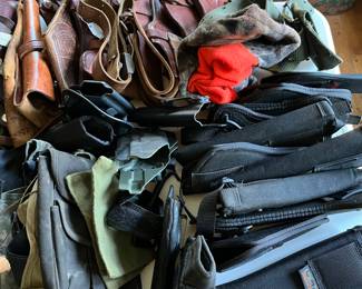 Numerous gun holsters and firearm accessories.