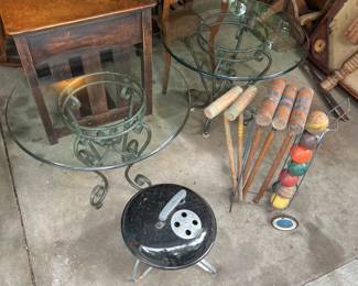 Matching glass-top tables with metal bases; vintage croquet set.