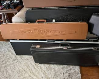 Numerous gun guards/cases, many vintage, by Doskocil, Browning, Plano, and others.