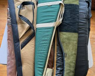 Numerous shotgun and rifle cases.