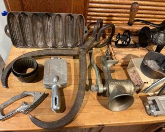Wagner Ware Junior Krusty Korn Kobs corn stick pan; antique ice tongs; vintage Fish Master scaler; vintage sinker molds.