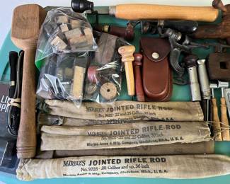 Vintage Marble’s jointed rife rods; antique Redlich’s wood beer tap; vintage powder measures; mold to create worm-shaped baits; antique cast iron shotgun shell reloading tool; and many more vintage hunting tools and accessories.