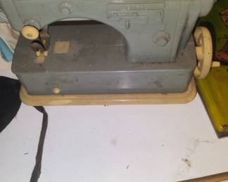 408.TOY SEWING MACHINE $15