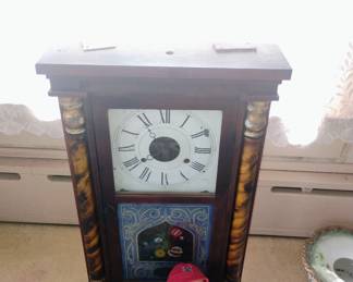 13.  ANTIQUE CLOCK  $65