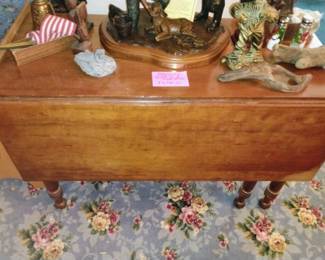 562. ANTIQUE DROP LEAF TABLE $105