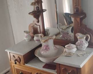 26. ANTIQUE MARBLE TOP DRESSER WITH MIRROR $375