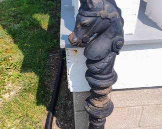 HORSES HEAD OUT SIDE. CAST IRON, BUT YOU HAVE TO REMOVE IT.