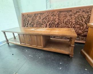 Carved heavy, large wall hanging and long coffee table with storage