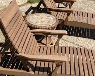Amish polywood chaise lounges with cushions from Sunnyland, tile top tables from Casual Living