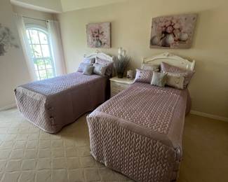 Twin room with white beds, custom linens