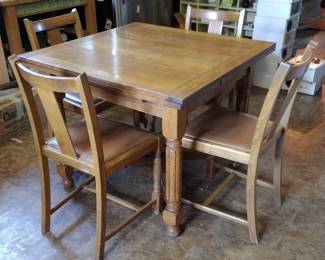 English oak draw leaf dining table and four chairs