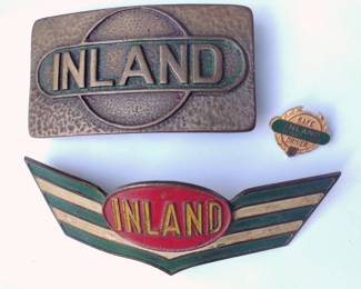INLAND BUCKLE, HAT BADGE AND SAFETY AWARD PIN