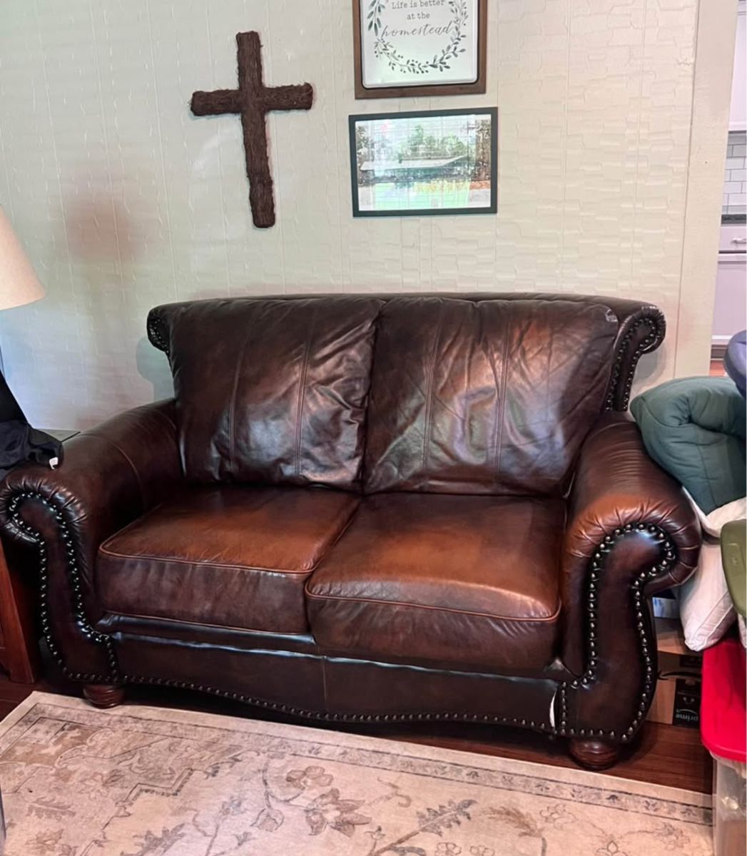 Leather loveseat - one small tear in front shown 