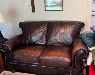 Leather loveseat - one small tear in front shown