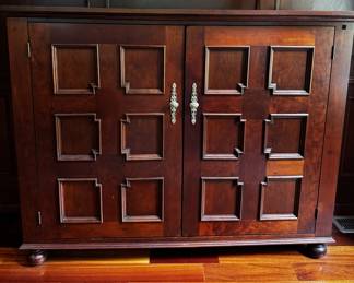 This is an awesome cabinet, made to order. With the press of a button (on a remote), the whole top lifts up for TV watching. See next photo.