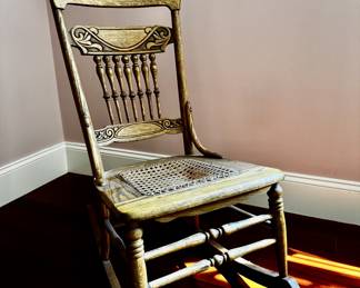 Oak rocking chair with caned seat