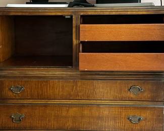 Detail of vintage dresser: storage with door and more drawers.
