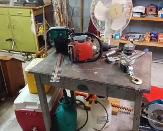 Oldcgreen painted table with chain saws 