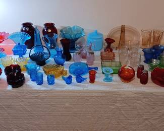 Table full of colored glassware