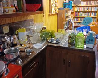 Vintage glassware and small appliances in basement kitchen