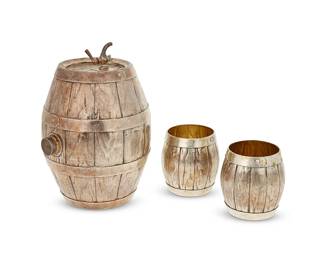 2
A Continental .800 silver drinks set
Late 19th/early 20th century
Each with indistinct hallmarks and marked: 800
Comprising a vessel in the form of a wine cask and a pair of cask-form cups with gilt interiors
3 pieces
Cask: 7.75" H x 5" Dia.; Each cup: 3.25" H x 3.125" Dia.
Total weight: 29 oz. troy approximately
Estimate: $700 - $900