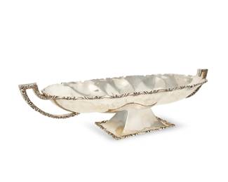 3
A large Mexican sterling silver footed oval center bowl
Mid-20th century
Marked to underside: Sterling / 0.925 / Lafayette; further marked with an eagle in a cartouche
With opposed handles, raised on a rectangular foot
7" H x 28.5" W x 10.5" D
113.1 oz. troy approximately
Estimate: $2,000 - $3,000