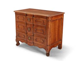 297
A French Provincial fruitwood commode
19th century and later
The three-drawer commode with serpentine front paneling and brass escutcheons, raised on scrolled front feet, each drawer interior with later moiré lining
33.25" H x 40" W x 22" D
Estimate: $300 - $500