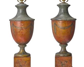 152
A pair of Neoclassical-style polychromed tole table lamps
19th century with later elements
Of urn form with red ground, later mounted as single-light lamps, each painted with swags and leaf tips on the body and musical trophies on the square plinth bases, electrified
2 pieces
To top of urn: 21.75" H; Each overall: 29.5" H x 7.5" Dia.
Estimate: $400 - $600