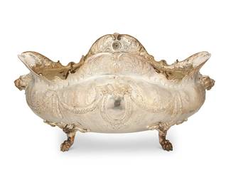 11
A large Victorian-style sterling silver footed center bowl
19th century
Marked indistinctly for maker and: 925
With chased and repoussé foliate motifs, featuring garland swags and opposed lion head masks in high relief, raised on paw feet
10.25" H x 21" W x 14" D
77.4 oz. troy approximately
Estimate: $1,500 - $2,000