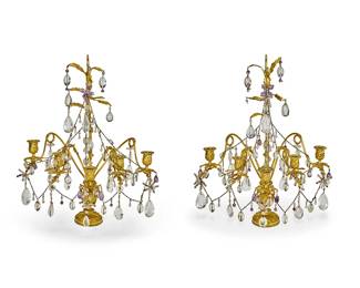330
A pair of French gilt-bronze five-light girandoles
20th century
Each decorated with snakes figures and leaves, with chain swags and glass, rock crystal, and amethyst drops, raised on an urn-form base
2 pieces
Each: 22.5" H x 19.5" Dia.
Estimate: $400 - $600