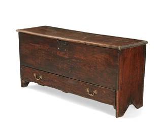149
An English oak blanket chest
18th century
Carved recto: NT 1719
With a hinged locking lift-top opening to reveal an interior till and later moiré lining, above a single drawer, with boot jack-style sides, legs, and feet
23.5" H x 50.5" W x 15" D
Estimate: $700 - $900